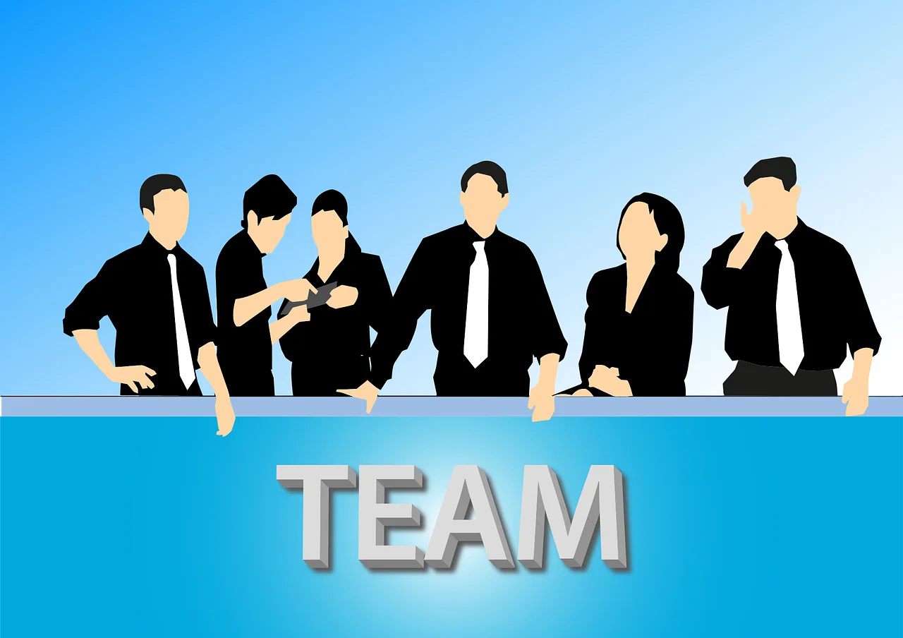 Postaci pracowników z napisem team