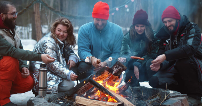 Company bonfire in the mountains in winter, team building